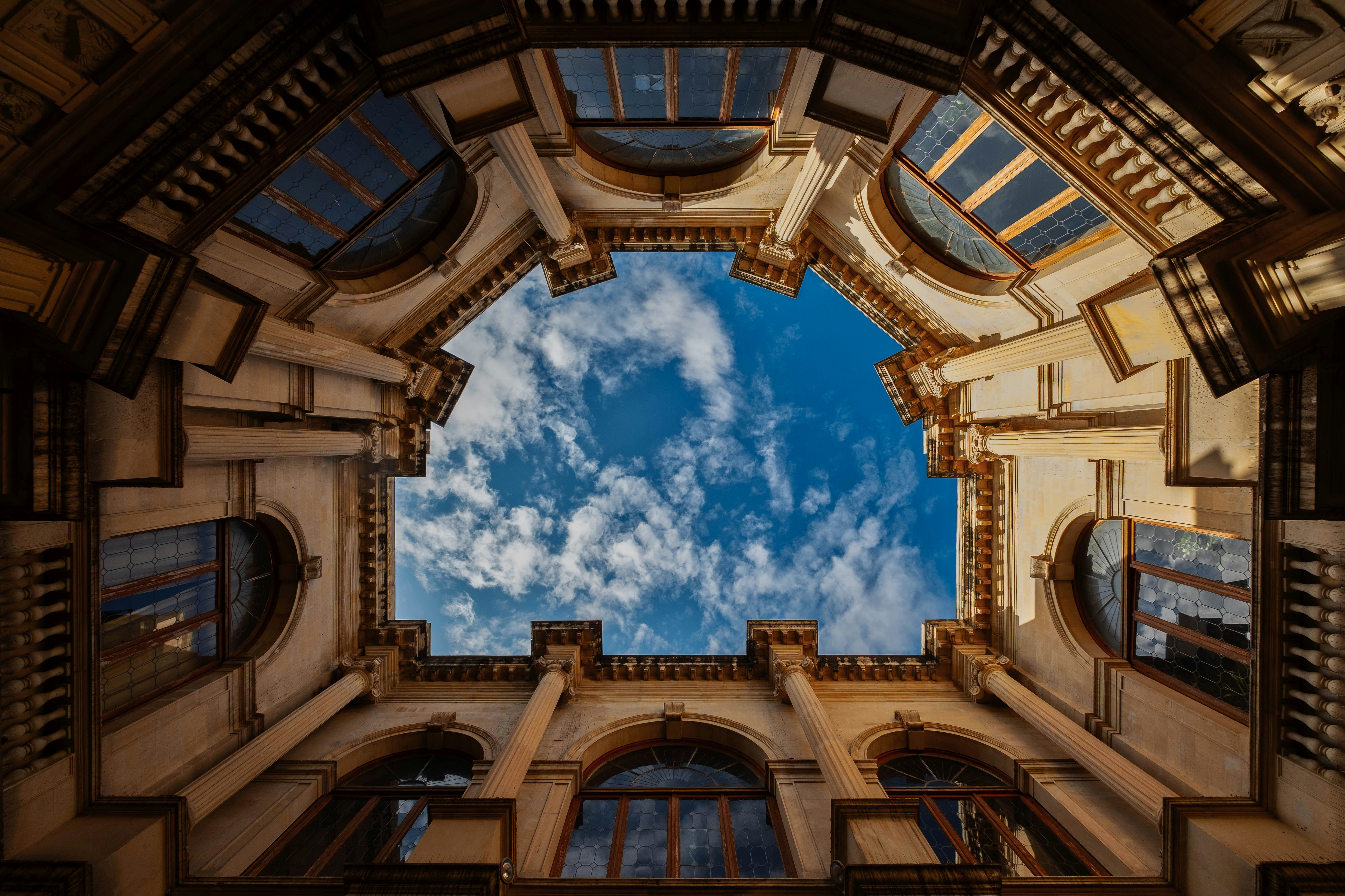 worms-eye-view photography of white and blue house